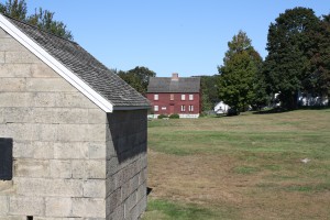 Powder magazine (foreground) with Ebenezer Avery House in the background.